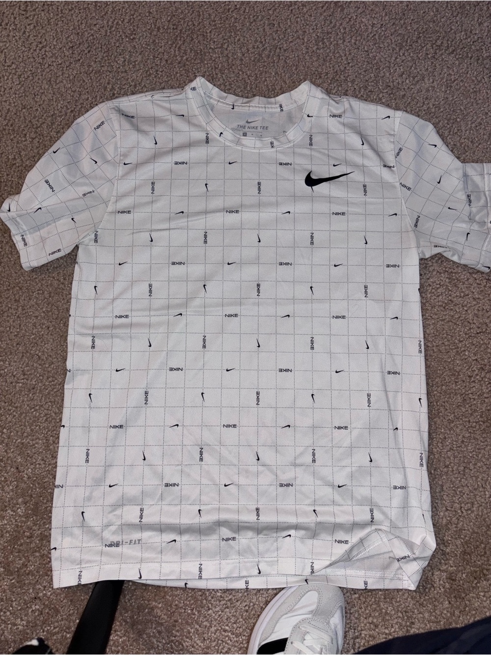 Nike White Short-Sleeve Grid Performance Tee with Black Swoosh